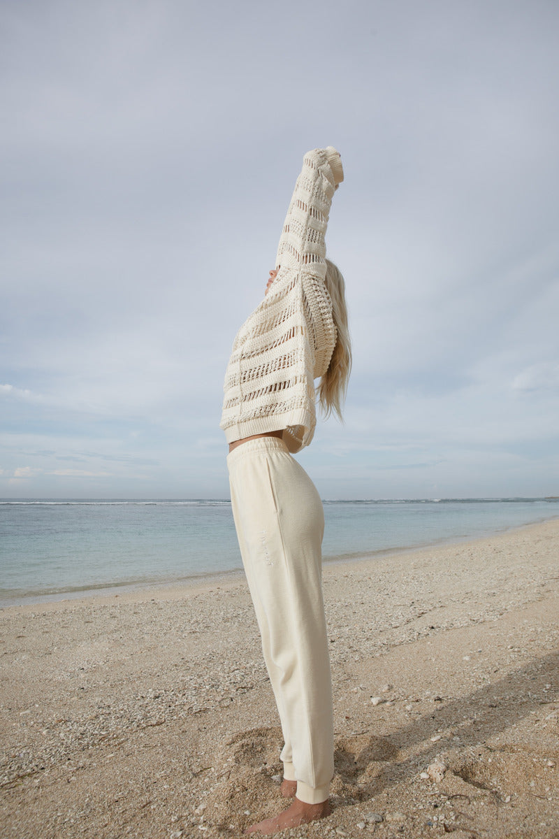 Women's cotton knit cream jumper side view