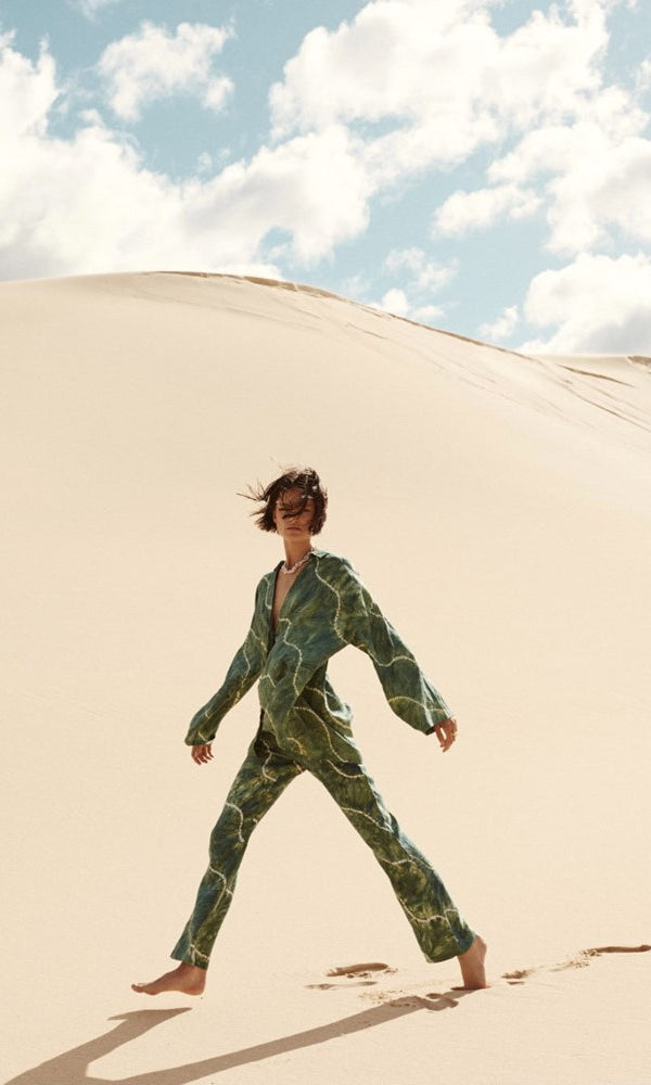 model wearing tie dye green linen set
