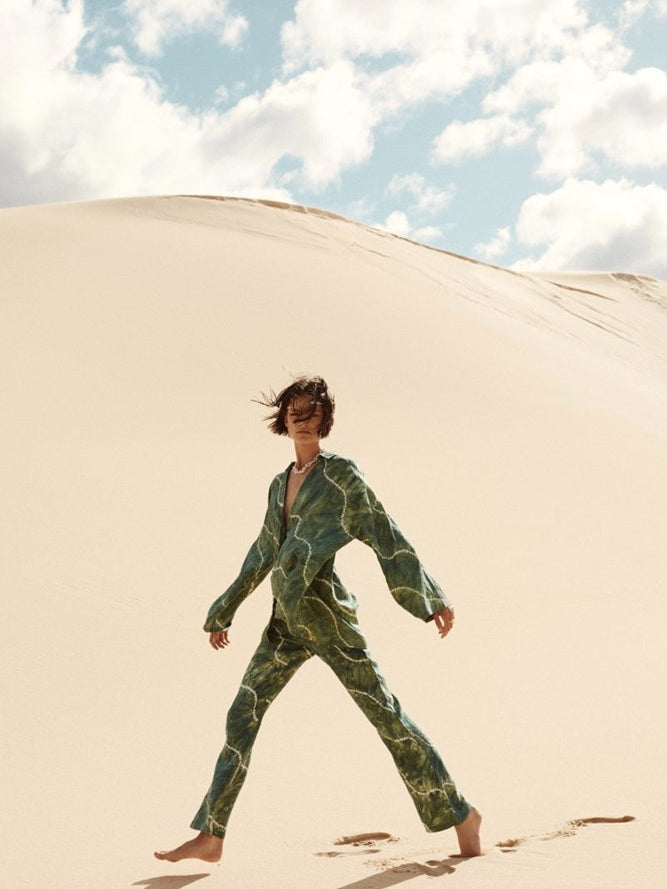 model wearing tie dye green linen set