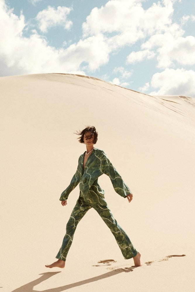 model wearing tie dye green linen set