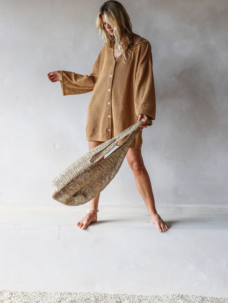 womens woven bag natural grass with model in mini dress
