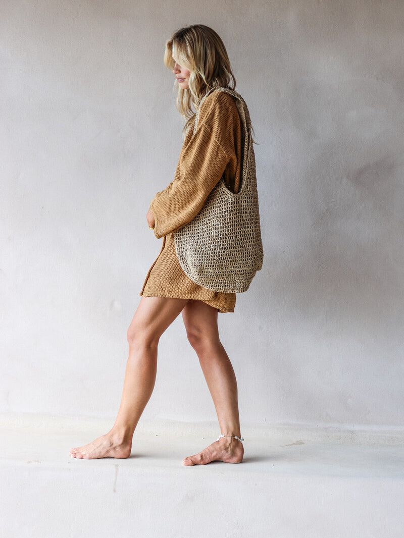 womens woven bag natural grass side view