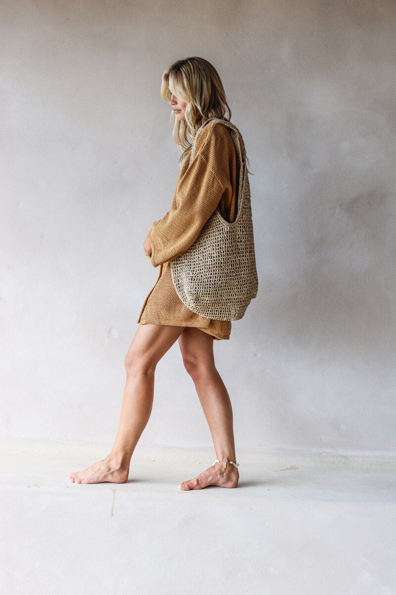 womens woven bag natural grass side view