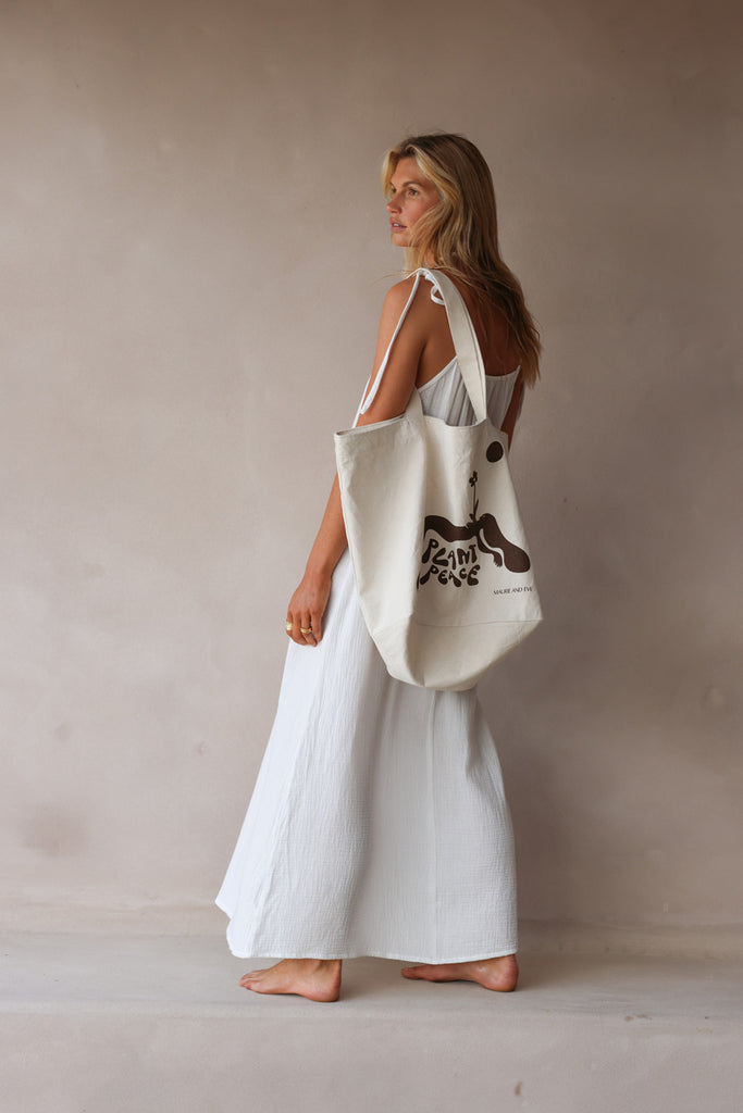model wearing printed canvas tote bag 