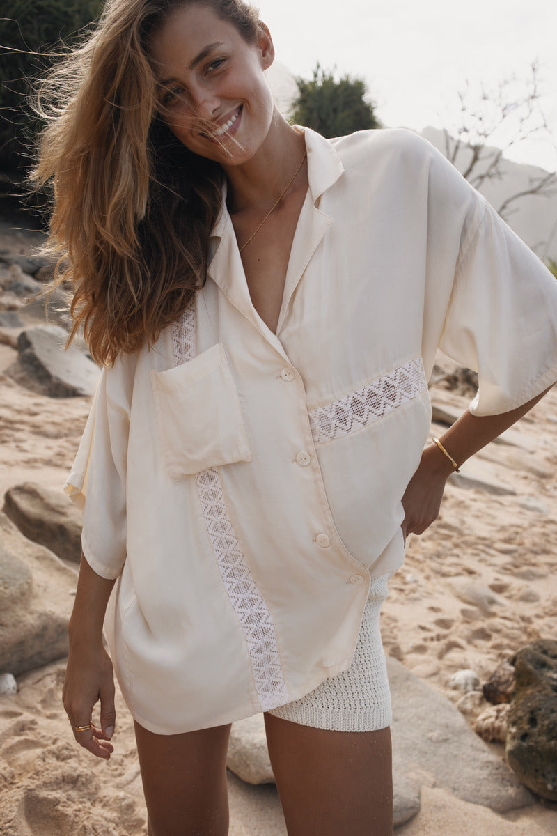 Womens cream coloured viscose lace shirt, close up view