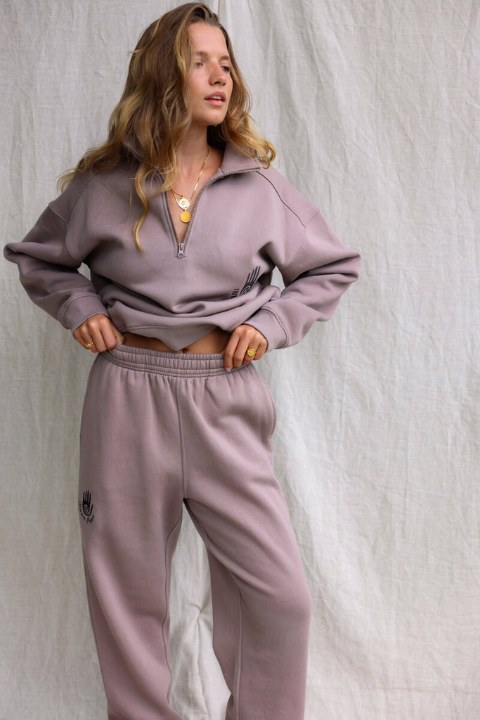 model wearing matching inner peace print tracksuit