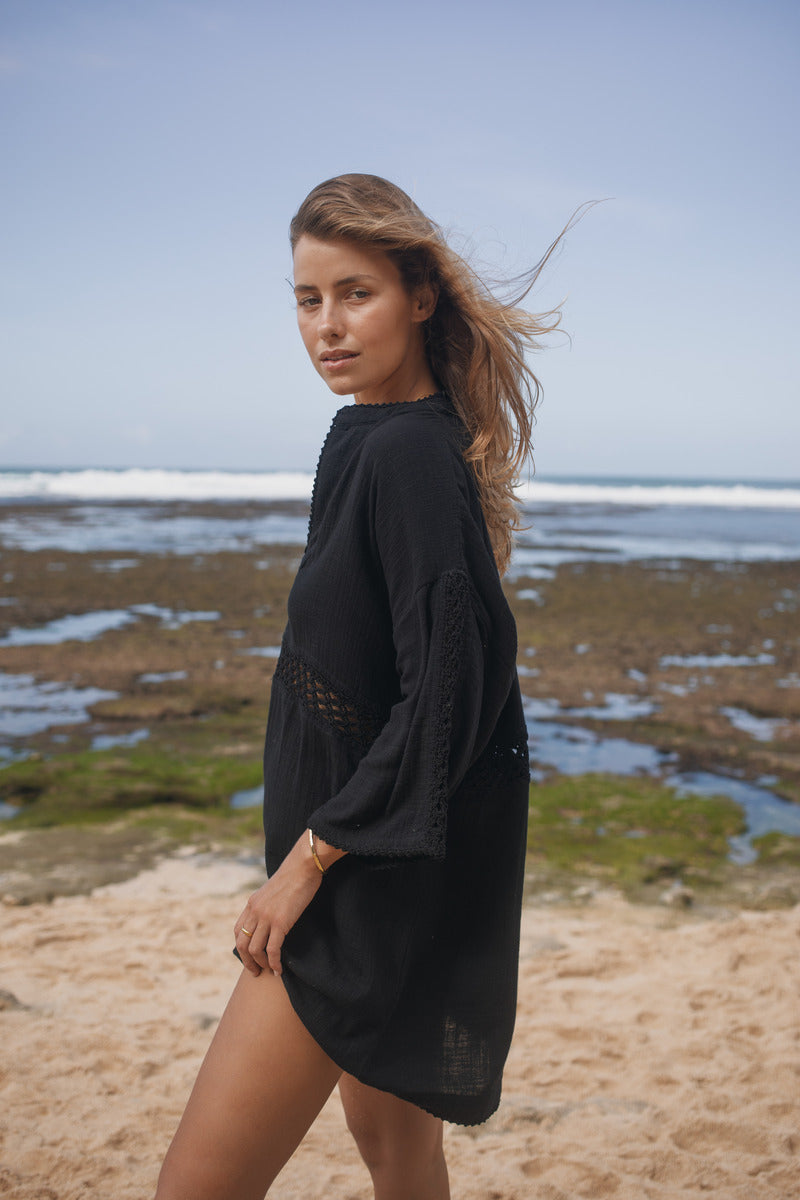 Womens black cotton crochet mini dress, side view