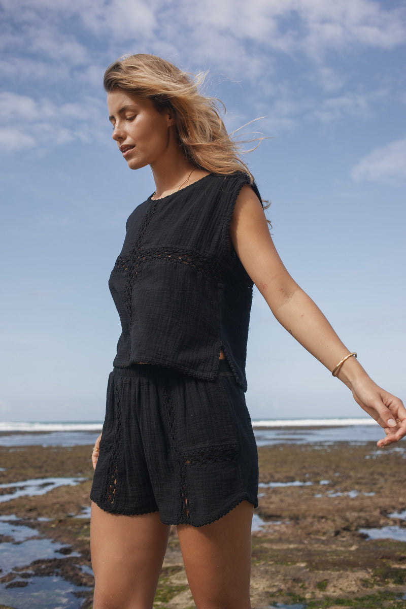 Womens black cotton crochet tank, styled with matching short, front view