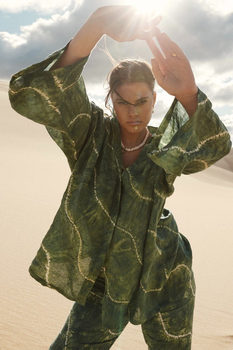 green tie dye shirt with cream swirl