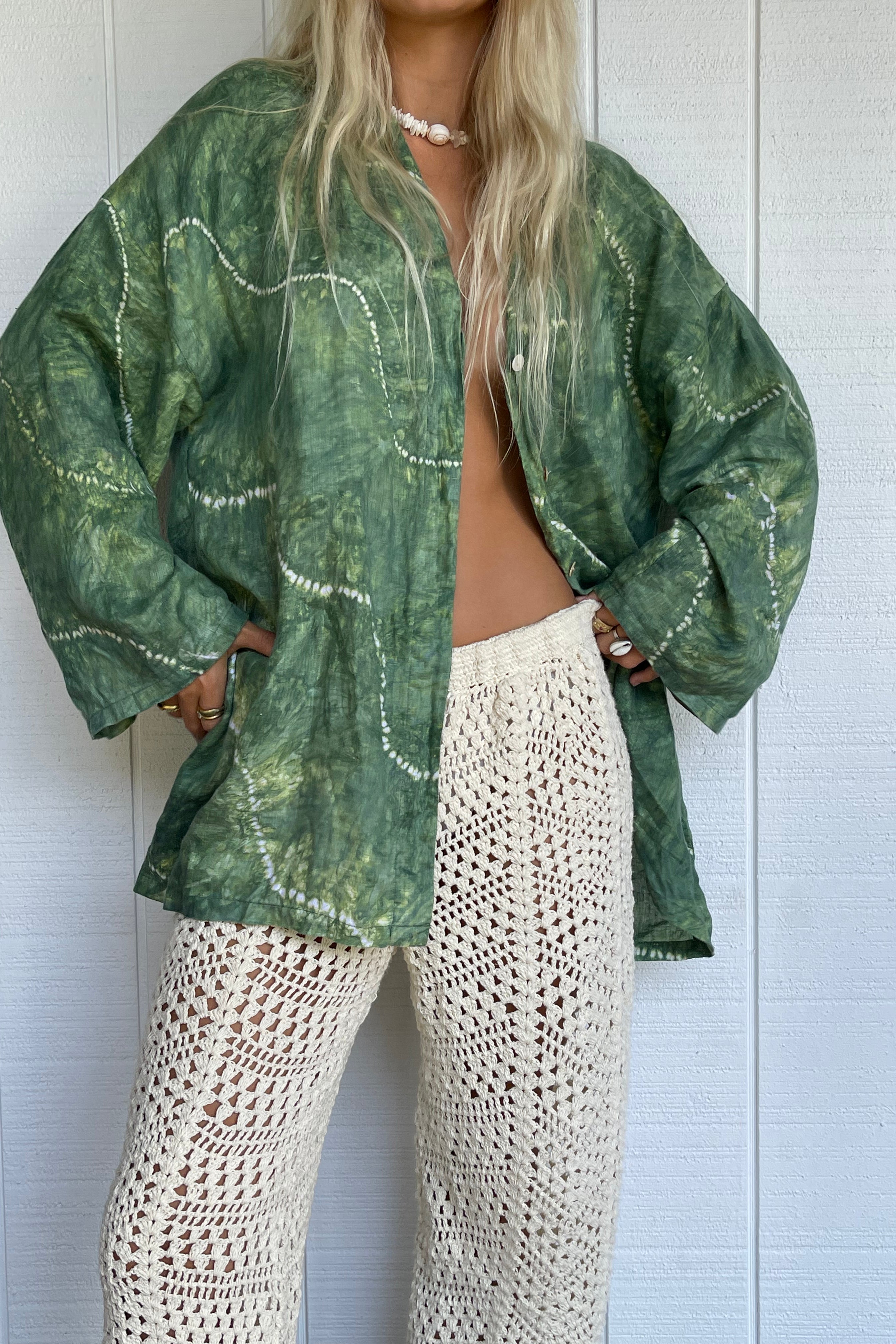Womens green linen tie dye shirt, styled with crochet pant front view