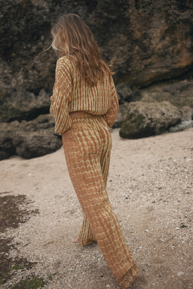 Womens tan cotton tie dye pant, walking view