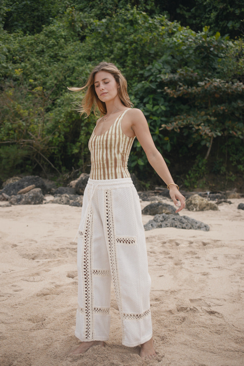 Womens tan cotton tie dye bodysuit, styled with cream pant, front view