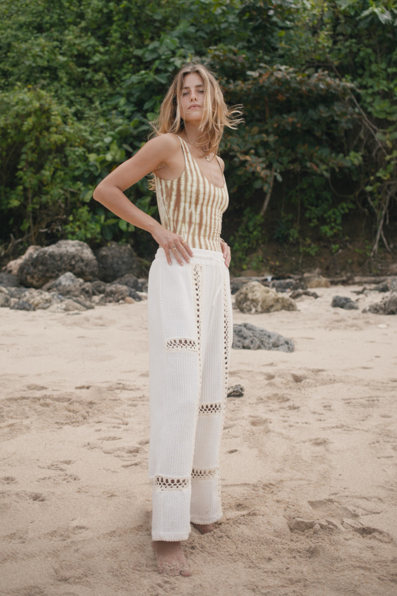 Womens tan cotton tie dye bodysuit, styled with cream pant, side view