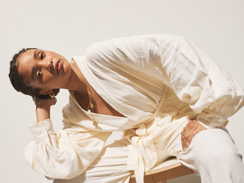 girl leaning over in lemon kimono top