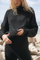Women's black merino wool blend knit jumper close up
