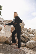 Women's black merino wool blend knit pant side view