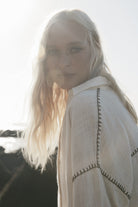 womens cotton cream shirt with contrast stitch close up view