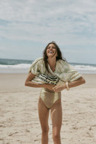 model wearing tie dye tee and bodysuit