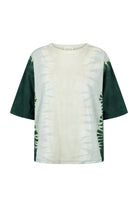 Tie-dye t-shirt with green and white pattern on a white background