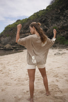 Womens cotton hemp tie dye taupe tee, styled with knit short, back view