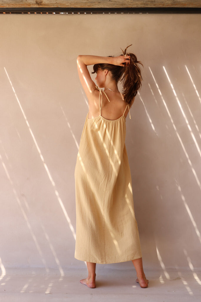 womens beige maxi dress with adjustable tie sides back view 