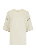 womens cotton cream top with pocket  and contrast stitch front view
