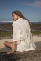 Womens cream coloured viscose lace shirt, back view