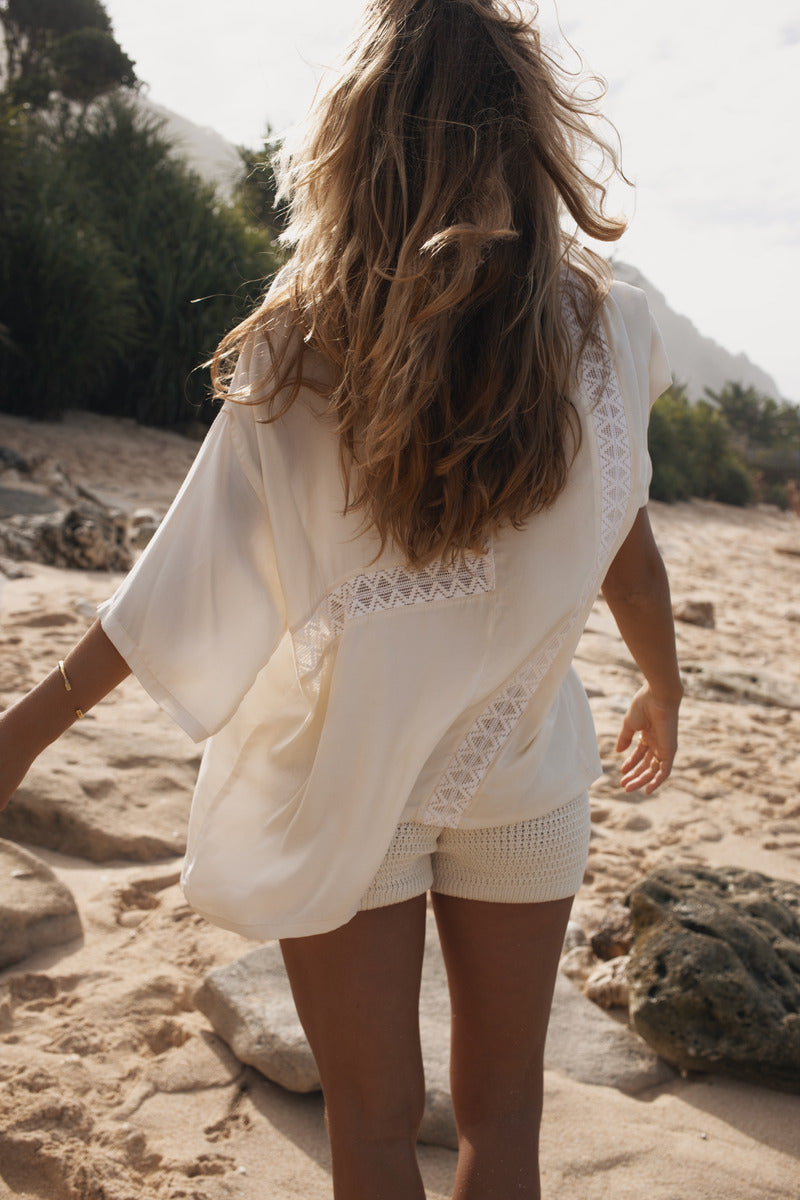 Womens cream coloured viscose lace shirt, back view