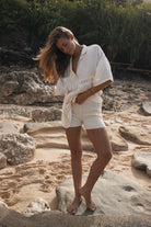 Womens cream coloured viscose lace shirt, styled with cream knit short, front view