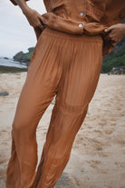 Womens Bran coloured viscose lace pant, styled with matching shirt, front view