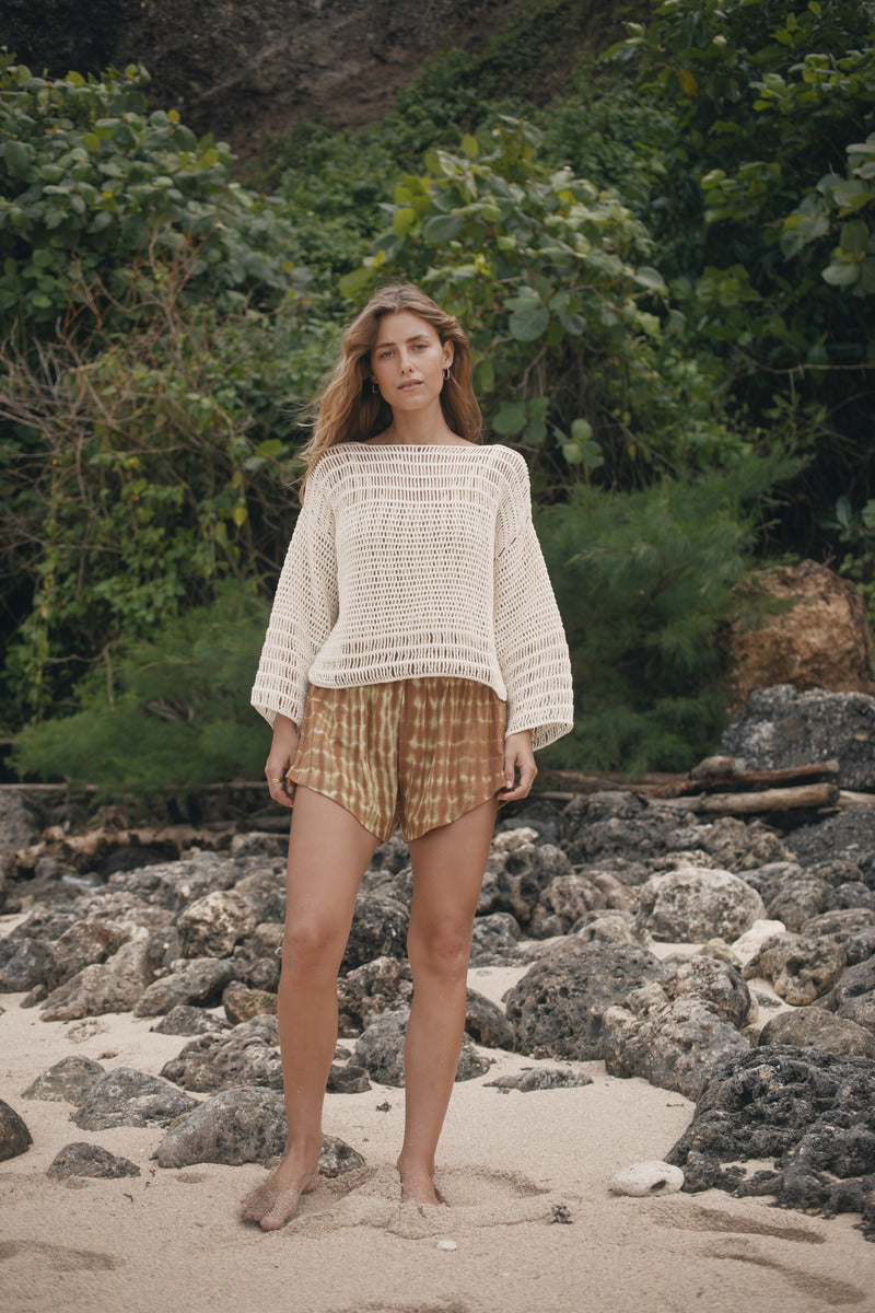Womens tan cotton tie dye short, styled with crochet top, front view
