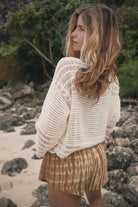 Womens tan cotton tie dye short, styled with crochet top, back view