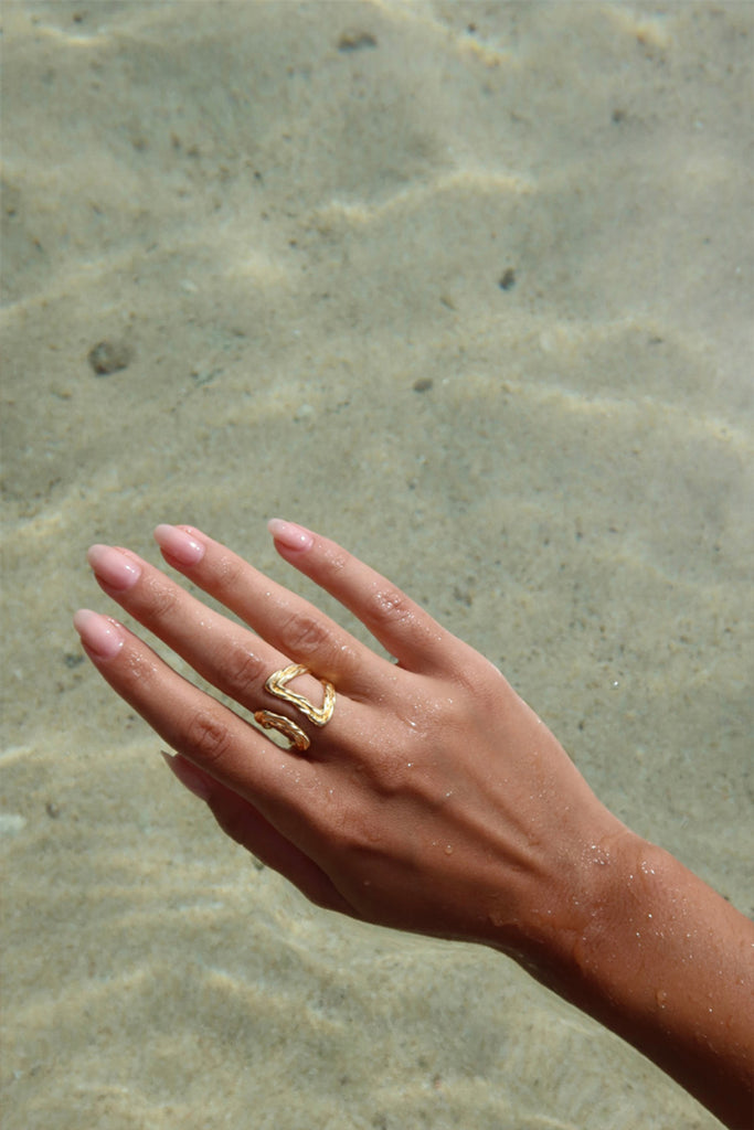 open twist shaped gold plaited ring 