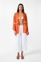 Womens white linen drawstring pant with crochet panels front view