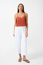 Womens white linen drawstring pant with crochet panels front view