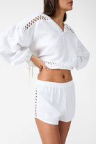 Womens white linen drawstring short with crochet panels side view 