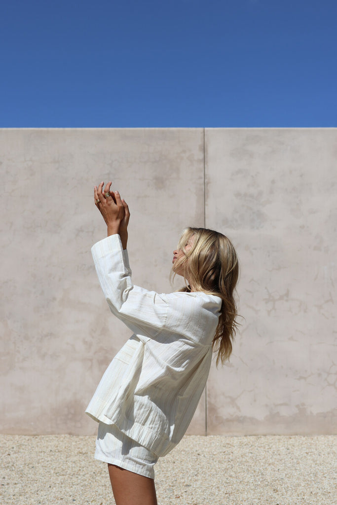 model wearing tonal stripe shirt and short set 