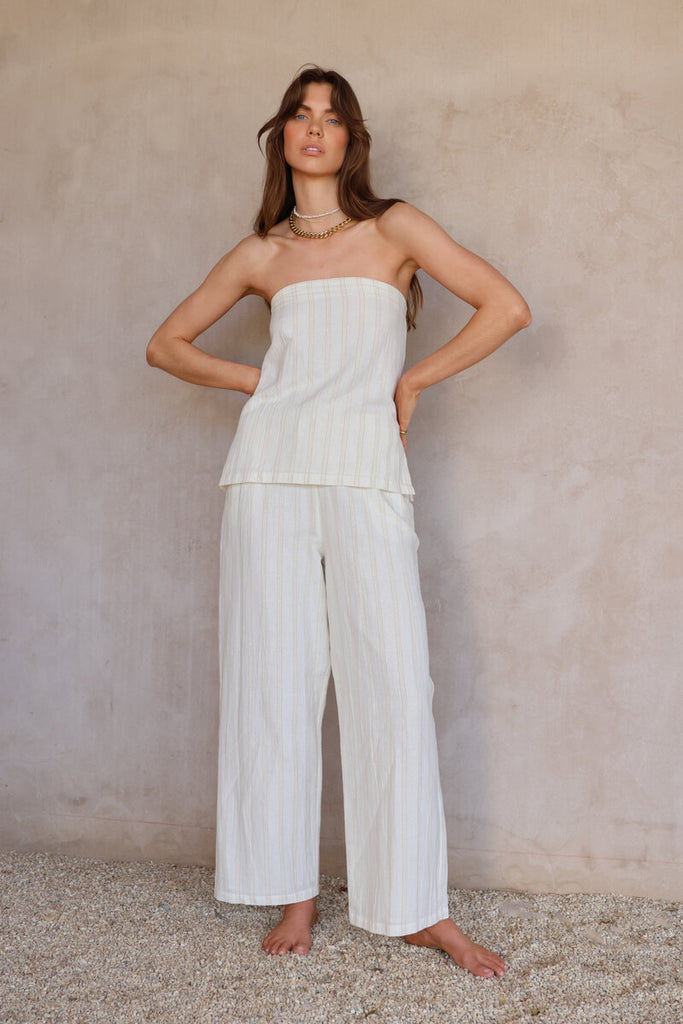 model wearing strapless top and pant set tonal stripes