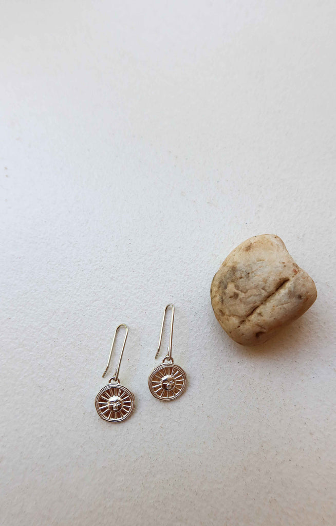 solid silver earrings with engraved sun motif