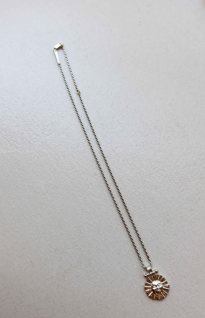 solid silver necklace with sun motif pendant