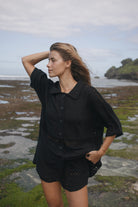 Womens black cotton crochet shirt, styled with matching short, front view