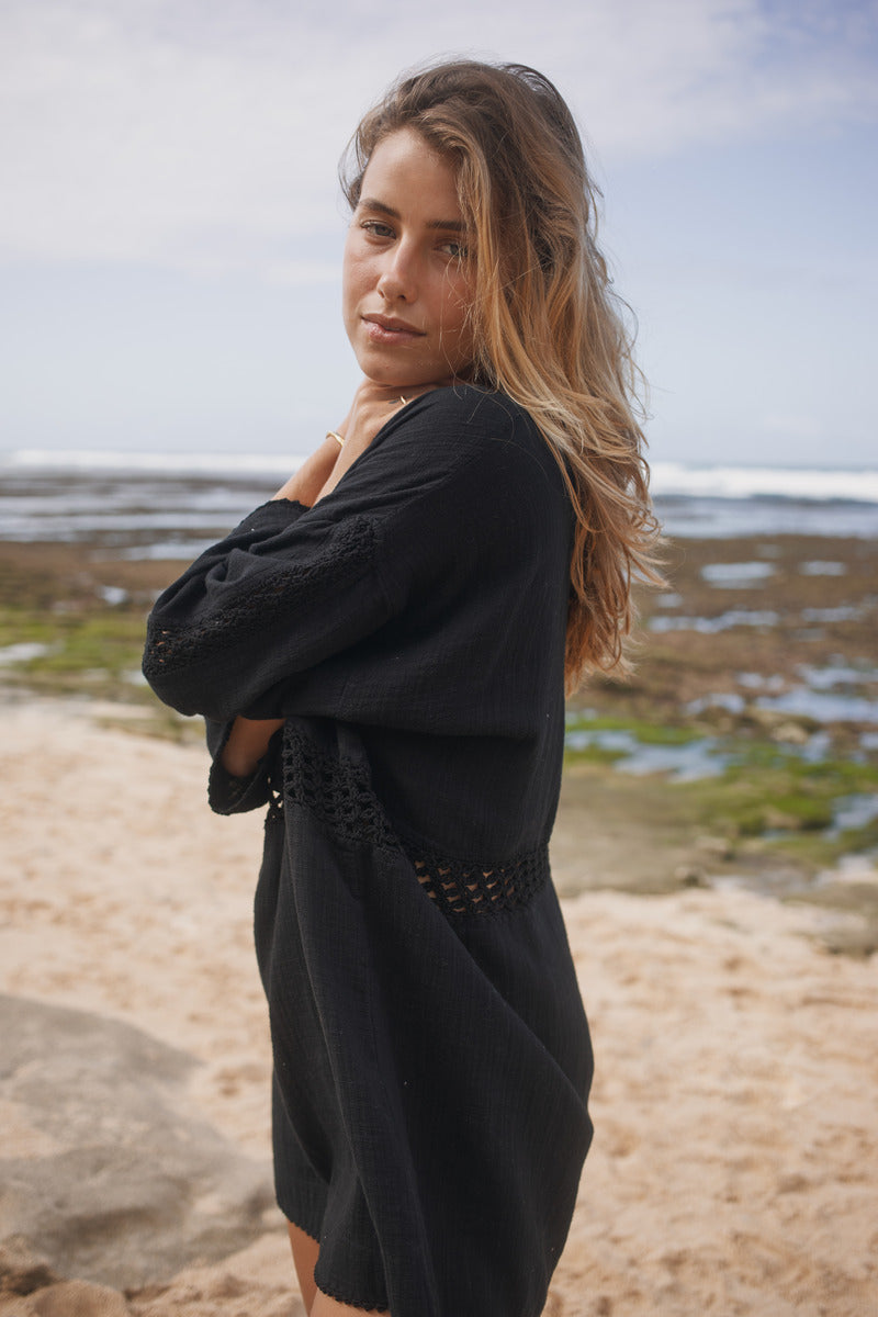 Womens black cotton crochet mini dress, side view