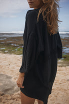 Womens black cotton crochet mini dress, back view