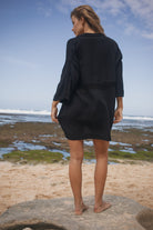 Womens black cotton crochet mini dress, back view
