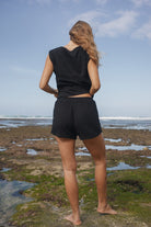 Womens black cotton crochet short, styled with matching tank, back view