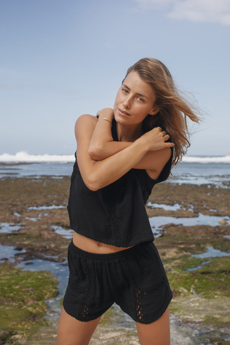 Womens black cotton crochet tank, styled with matching short, front view