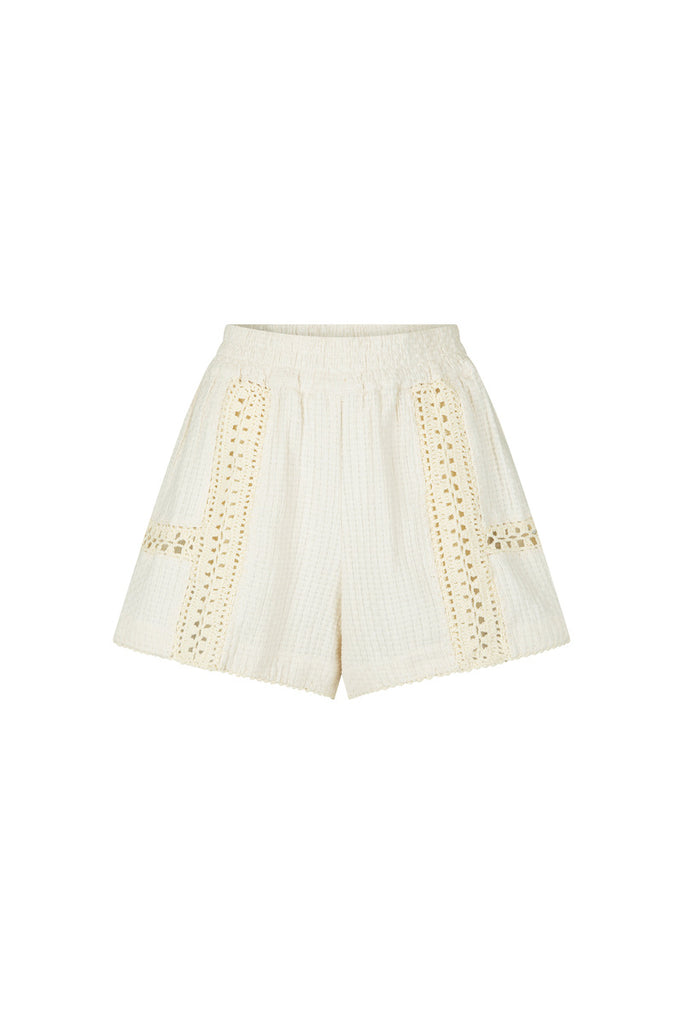 White shorts with decorative crochet cut-out details on a white background