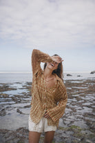 Womens tan cotton tie dye shirt, styled with cotton crochet short, front view