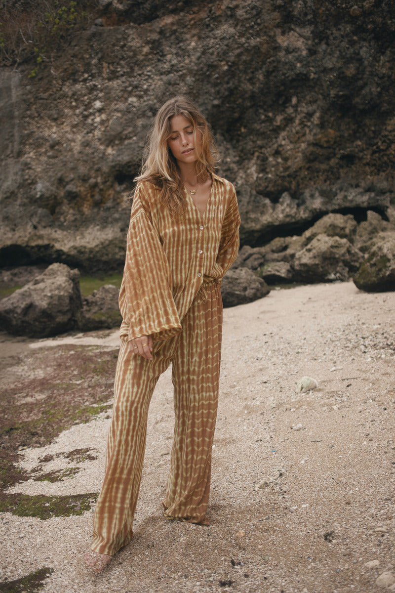 Womens tan cotton tie dye pant, styled with matching shirt, front view