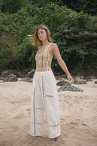 Womens tan cotton tie dye bodysuit, styled with cream pant, front view